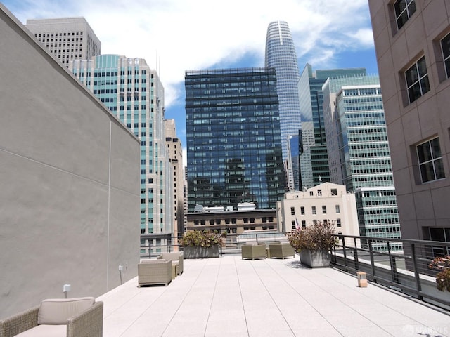 view of patio featuring a balcony