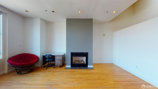 living area with light hardwood / wood-style floors