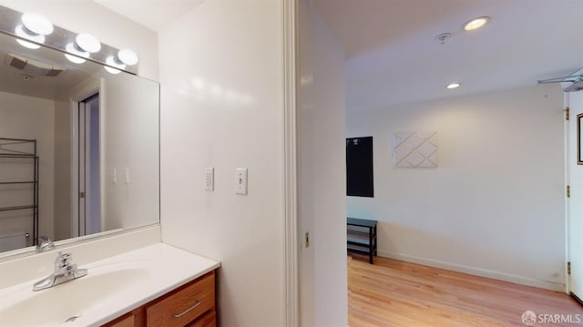 bathroom with wood-type flooring and vanity