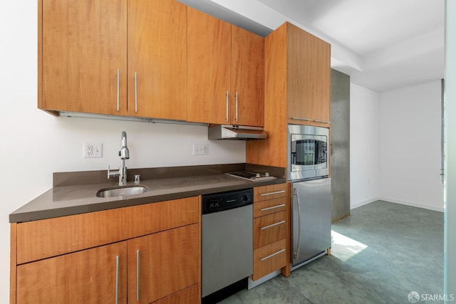 766 Harrison St Unit 403, San Francisco, CA 94107 - kitchen with stainless steel appliances, dark countertops, under cabinet range hood, and brown cabinetry