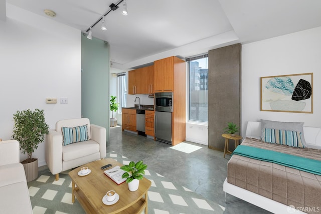 766 Harrison St Unit 403, San Francisco, CA 94107 - living room featuring concrete flooring and rail lighting