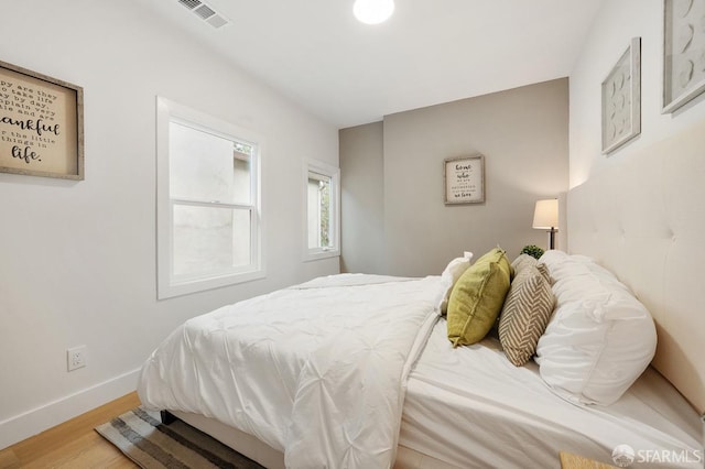 bedroom with light hardwood / wood-style floors