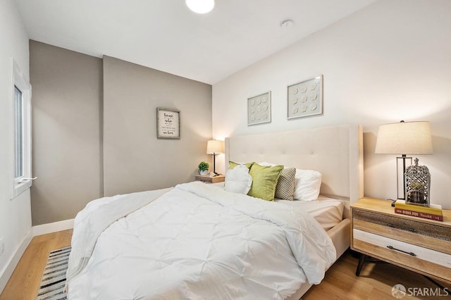 bedroom with light hardwood / wood-style flooring