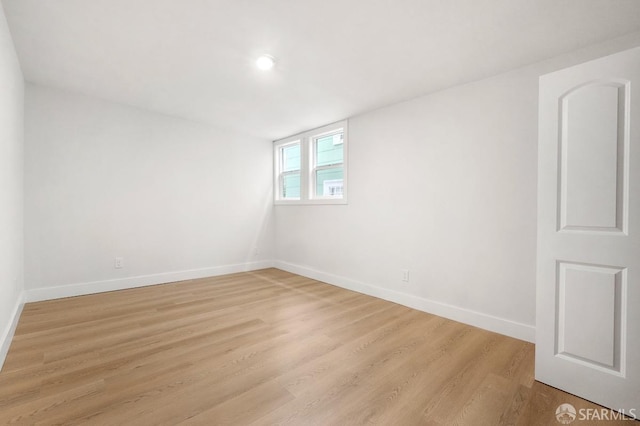 spare room with light hardwood / wood-style floors