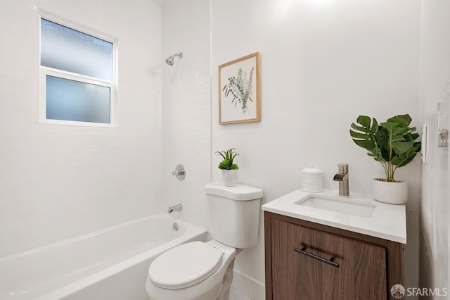 full bathroom featuring vanity, toilet, and tiled shower / bath