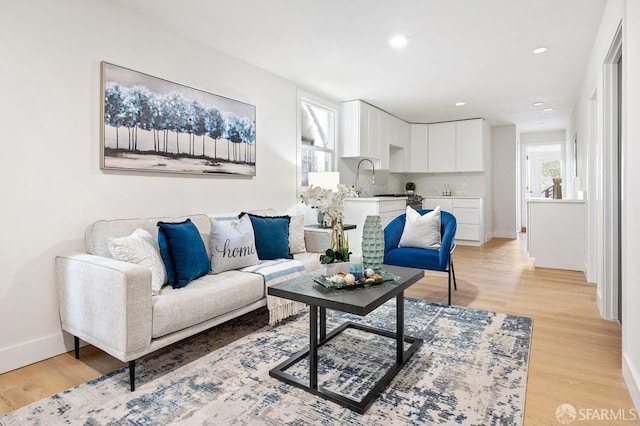 living room with light hardwood / wood-style flooring