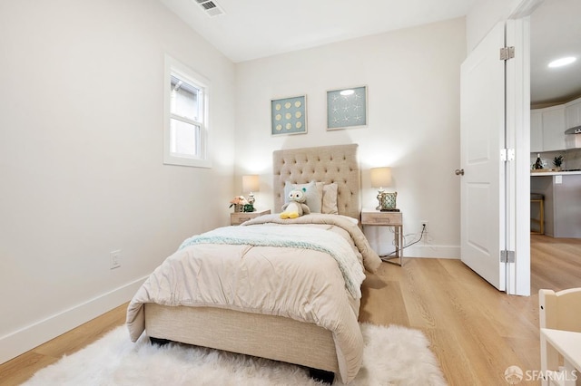 bedroom with light hardwood / wood-style floors