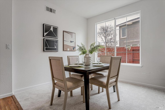 dining area featuring visible vents and baseboards