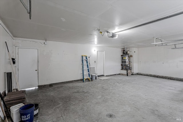 garage featuring secured water heater and a garage door opener