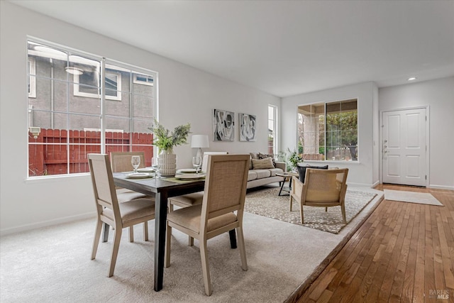 dining area with hardwood / wood-style flooring, baseboards, and recessed lighting