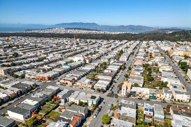 birds eye view of property with a mountain view