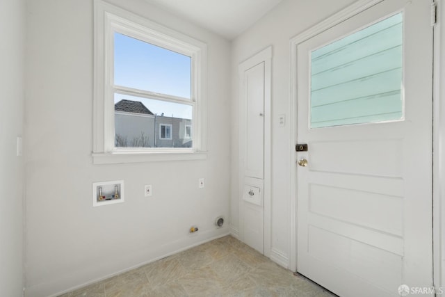 washroom with laundry area, hookup for a washing machine, hookup for an electric dryer, and baseboards