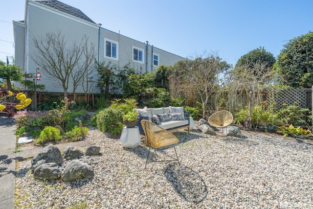 view of yard featuring an outdoor hangout area and fence