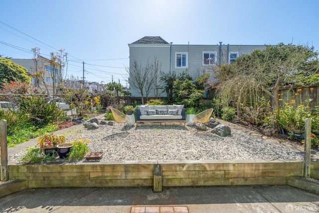 view of yard featuring an outdoor living space and a fenced backyard