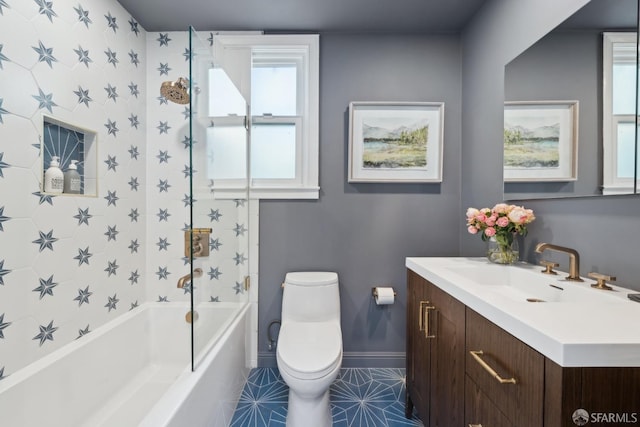 full bath with tile patterned flooring, baseboards, toilet, a bath, and vanity