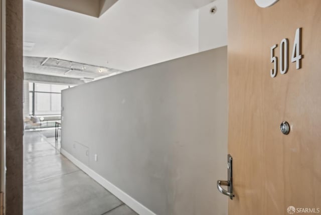 300 Beale St Unit 504, San Francisco, CA 94105 - hallway with baseboards and concrete flooring