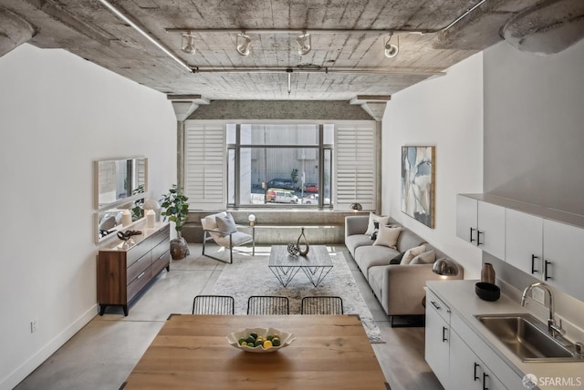 300 Beale St Unit 504, San Francisco, CA 94105 - living area featuring baseboards, track lighting, and concrete flooring