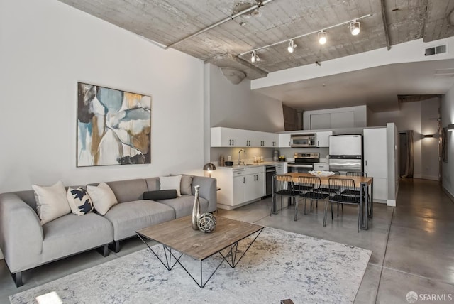 300 Beale St Unit 504, San Francisco, CA 94105 - living area featuring concrete floors and rail lighting