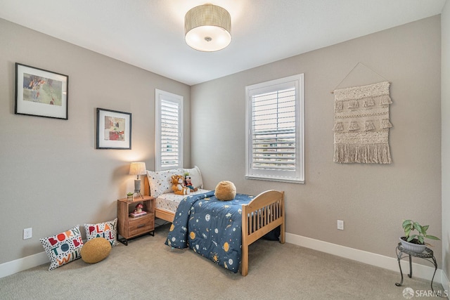 bedroom with carpet and baseboards