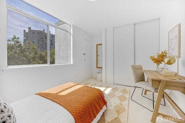 bedroom featuring a closet and carpet floors