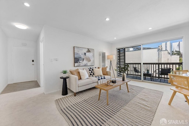 carpeted living room with baseboards and recessed lighting