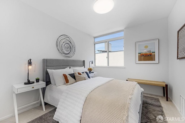 bedroom featuring carpet flooring and baseboards