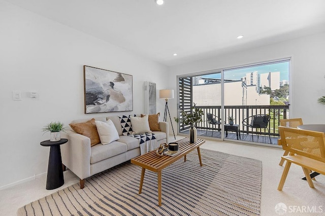 carpeted living room featuring recessed lighting and baseboards