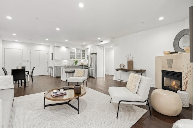 living room with dark hardwood / wood-style floors