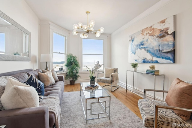 living room with an inviting chandelier and light hardwood / wood-style flooring