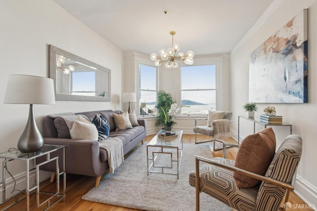 living area with hardwood / wood-style flooring and a chandelier