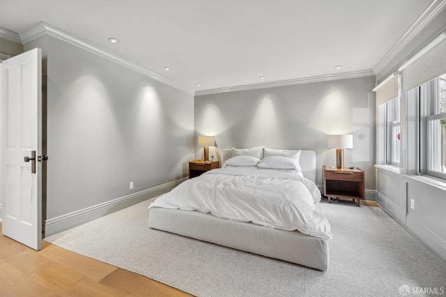 bedroom featuring baseboards, ornamental molding, recessed lighting, and light wood-style flooring