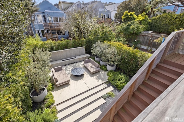 exterior space with stairs, a patio area, and a deck