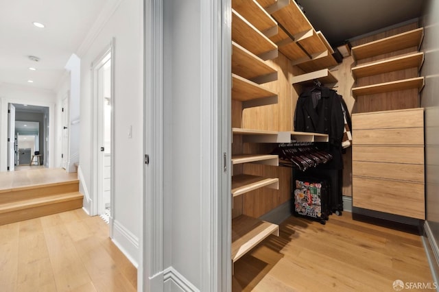 mudroom featuring ornamental molding, recessed lighting, baseboards, and light wood-style floors
