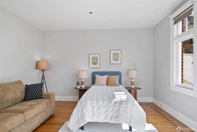 2195 Green St Unit 2, San Francisco, CA 94123 - bedroom featuring baseboards and wood finished floors