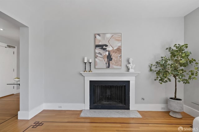 2195 Green St Unit 2, San Francisco, CA 94123 - living room with a fireplace with flush hearth, baseboards, and wood finished floors