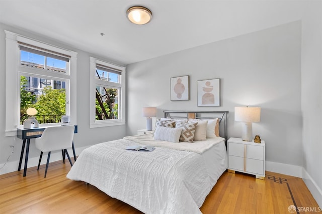 2195 Green St Unit 2, San Francisco, CA 94123 - bedroom with baseboards and wood finished floors