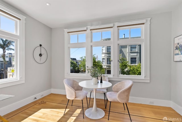 2195 Green St Unit 2, San Francisco, CA 94123 - dining area featuring a healthy amount of sunlight, baseboards, and wood finished floors