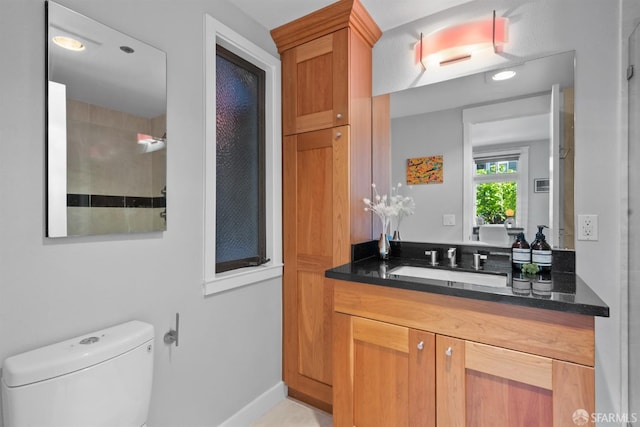 2195 Green St Unit 2, San Francisco, CA 94123 - bathroom featuring vanity, baseboards, and toilet