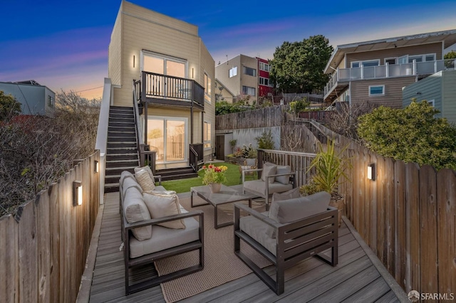 deck with stairs, an outdoor living space, and fence