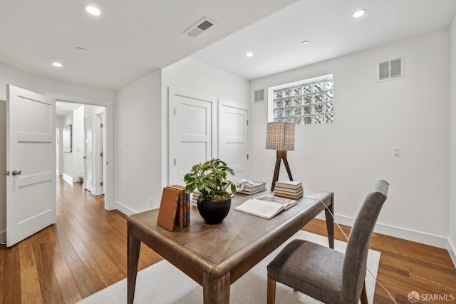 office space with recessed lighting, visible vents, and light wood finished floors