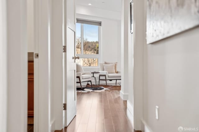 hallway with wood finished floors