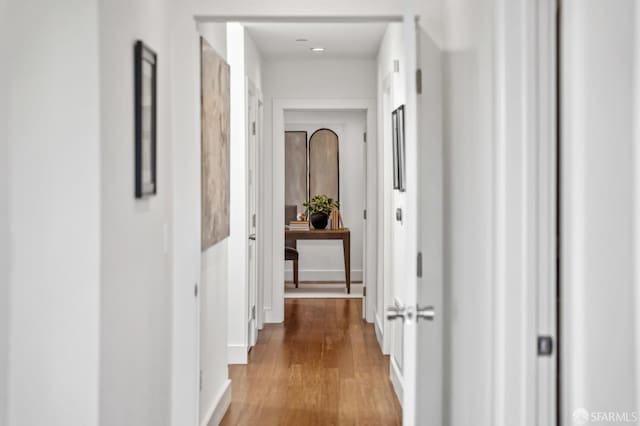 hallway with wood finished floors