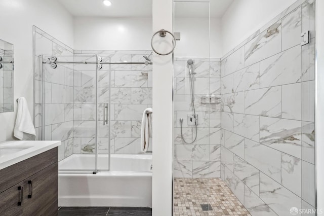 full bath featuring enclosed tub / shower combo and vanity