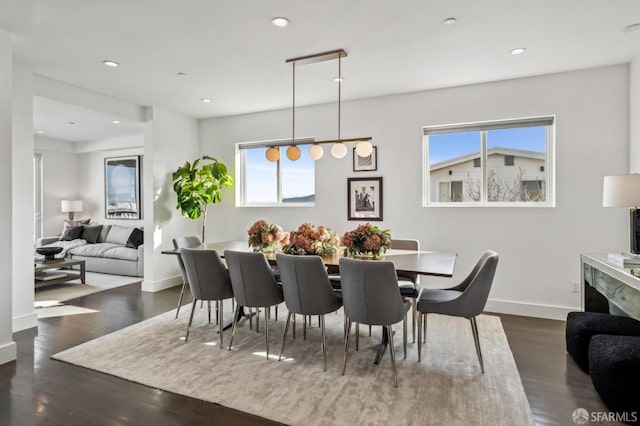 dining area with recessed lighting, dark wood-type flooring, and baseboards