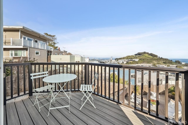 balcony featuring a water view