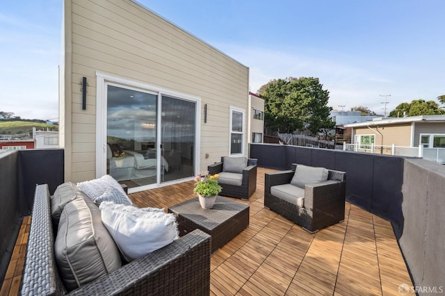 wooden terrace with outdoor lounge area