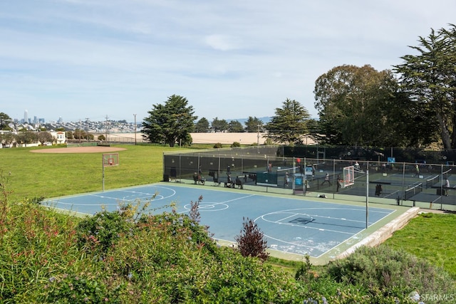 view of sport court with community basketball court, a yard, and fence