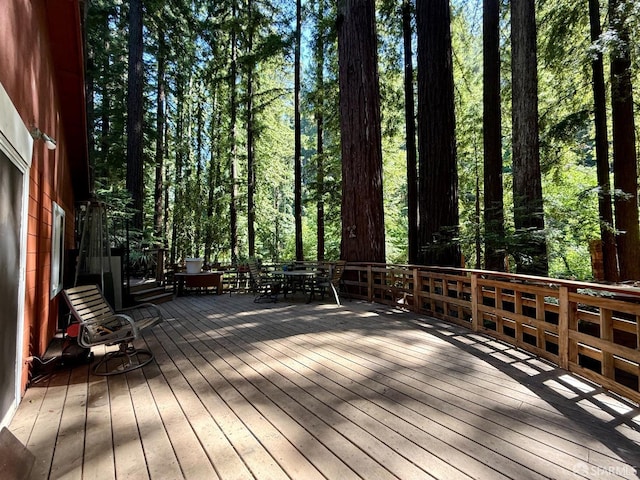 490 Huckleberry Ln, Boulder Creek, CA 95006 - wooden terrace featuring outdoor dining area and a wooded view