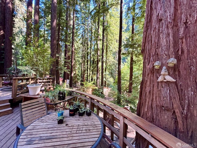 490 Huckleberry Ln, Boulder Creek, CA 95006 - wooden deck with outdoor dining space and a wooded view