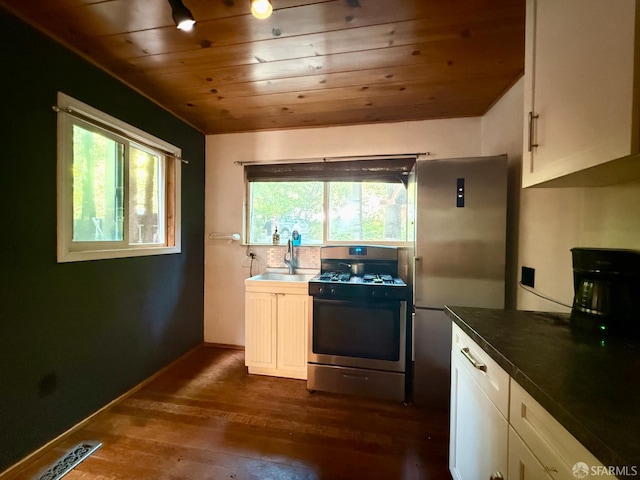 490 Huckleberry Ln, Boulder Creek, CA 95006 - kitchen with appliances with stainless steel finishes, healthy amount of natural light, wood ceiling, dark wood-style floors, and white cabinets